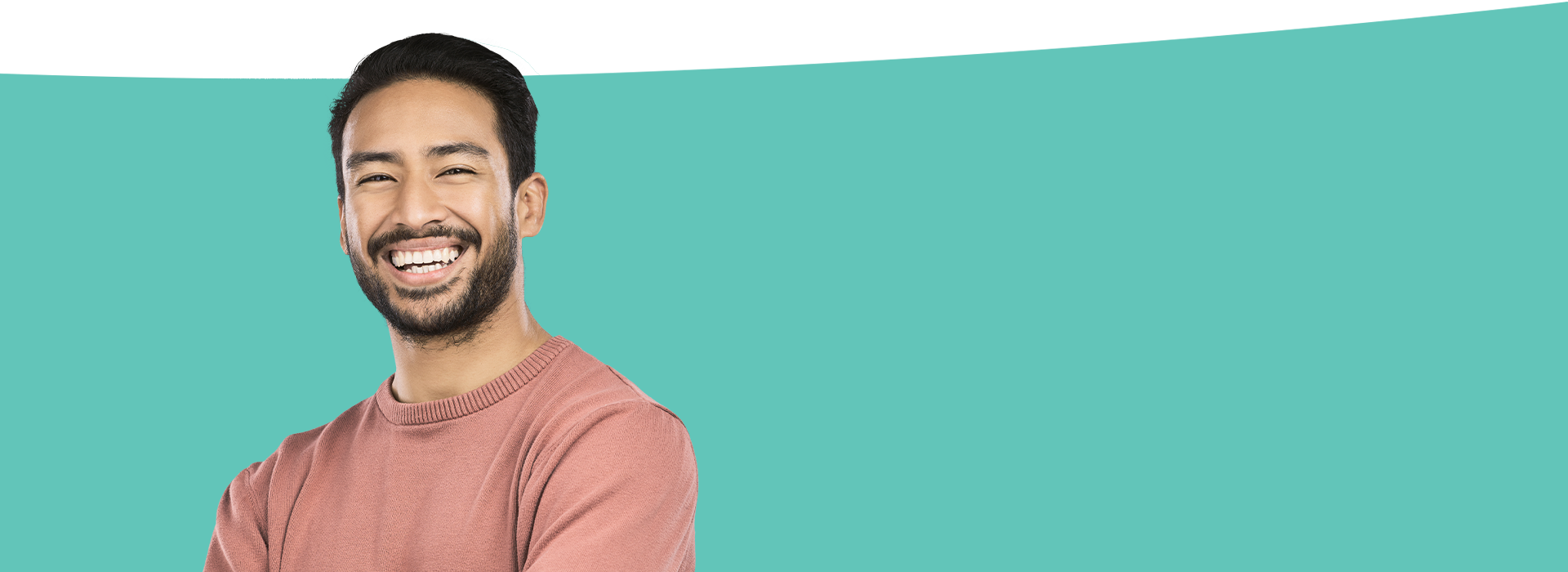 The image features a smiling man with dark hair against a blue background, wearing a light-colored top.